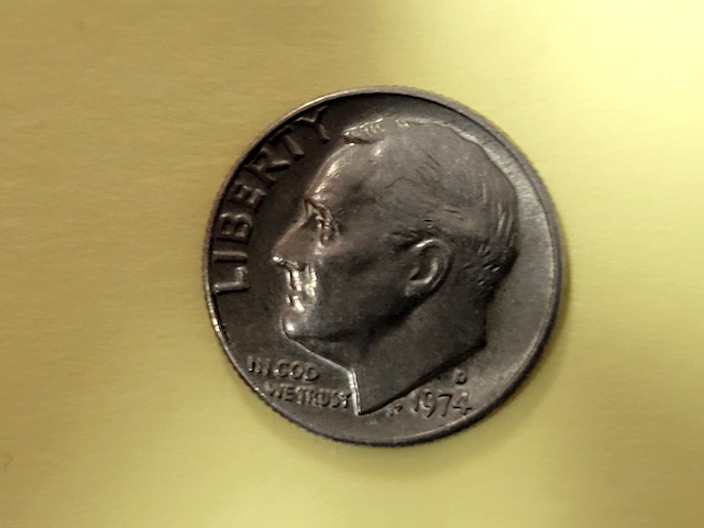 1974 Roosevelt dime obverse with doubled die error showing doubling in LIBERTY and the date digits