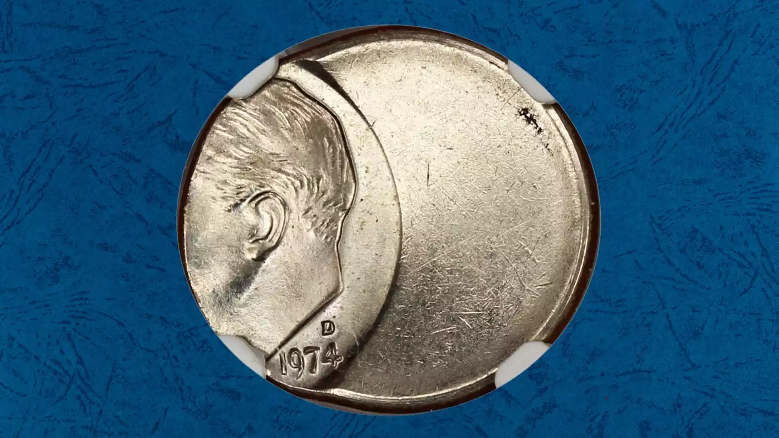1974 Roosevelt dime off-center strike error showing blank planchet area with partial design